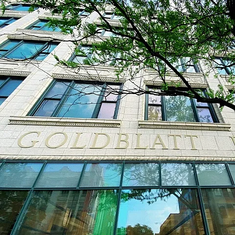 front of former goldblatt department store with green windows and terracotta