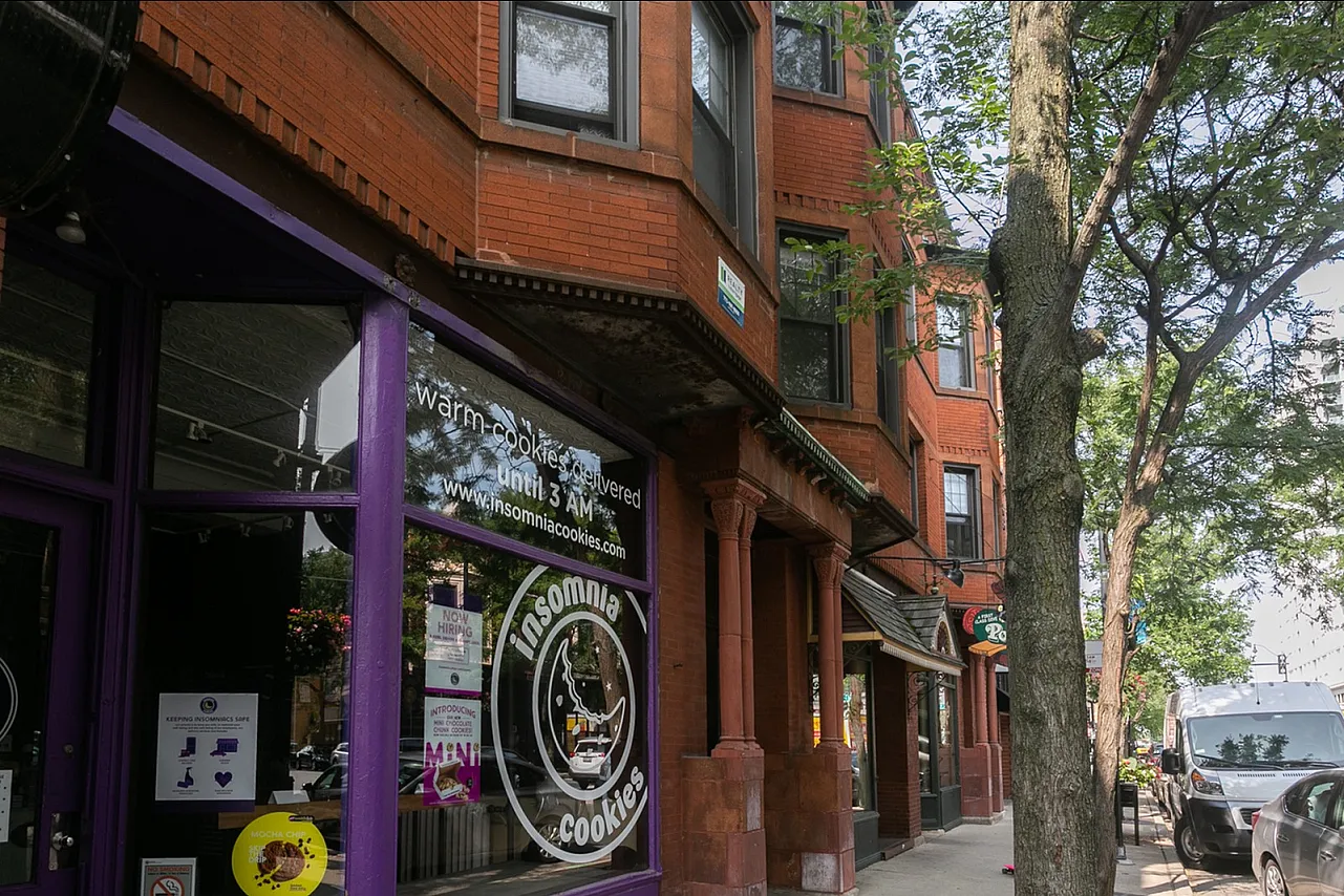 Exterior of 2256-64 North Lincoln Avenue a handsome twelve unit vintage red brick property with storefronts on the first floor in Lincoln Park.