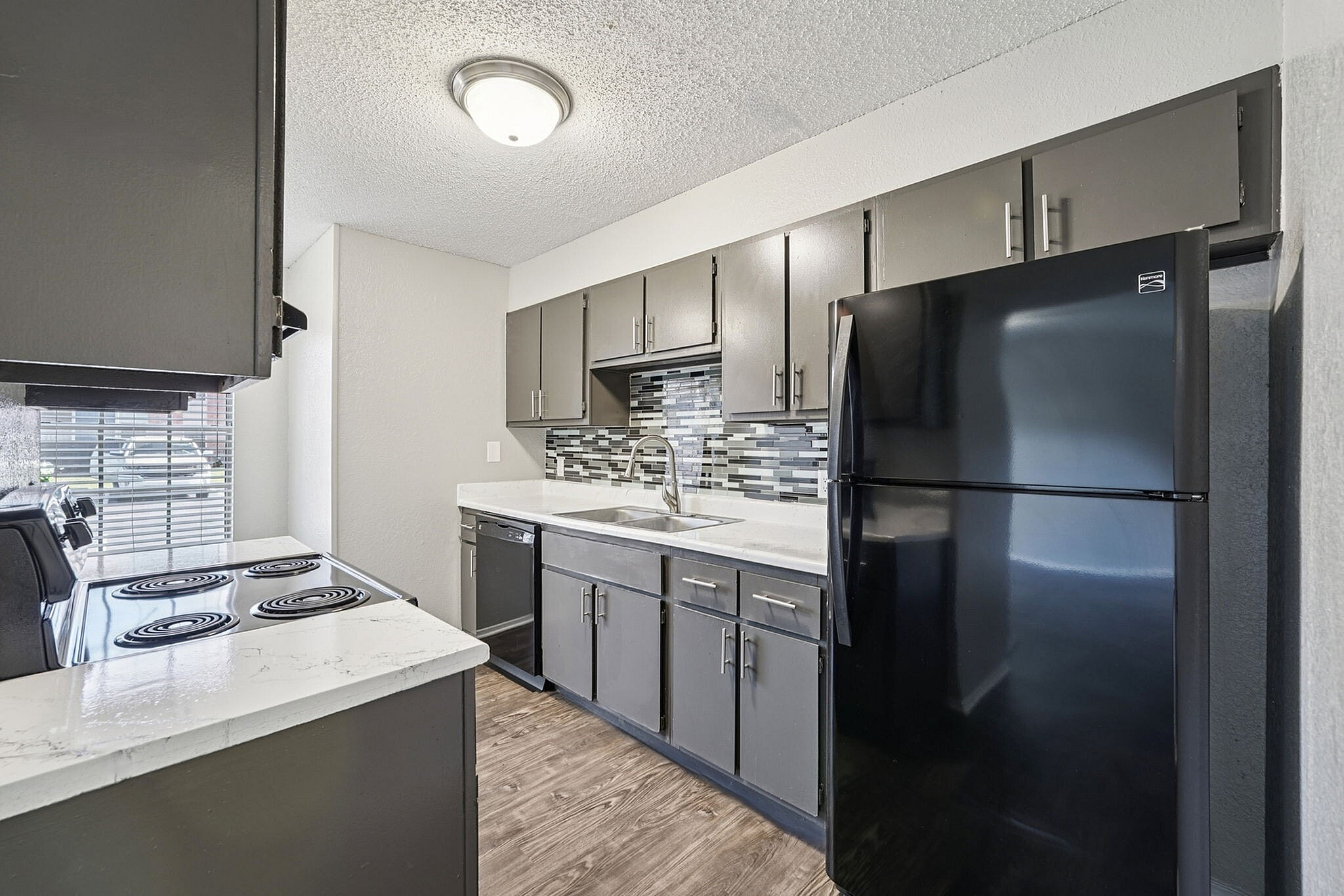 state of the art kitchen with black appliances