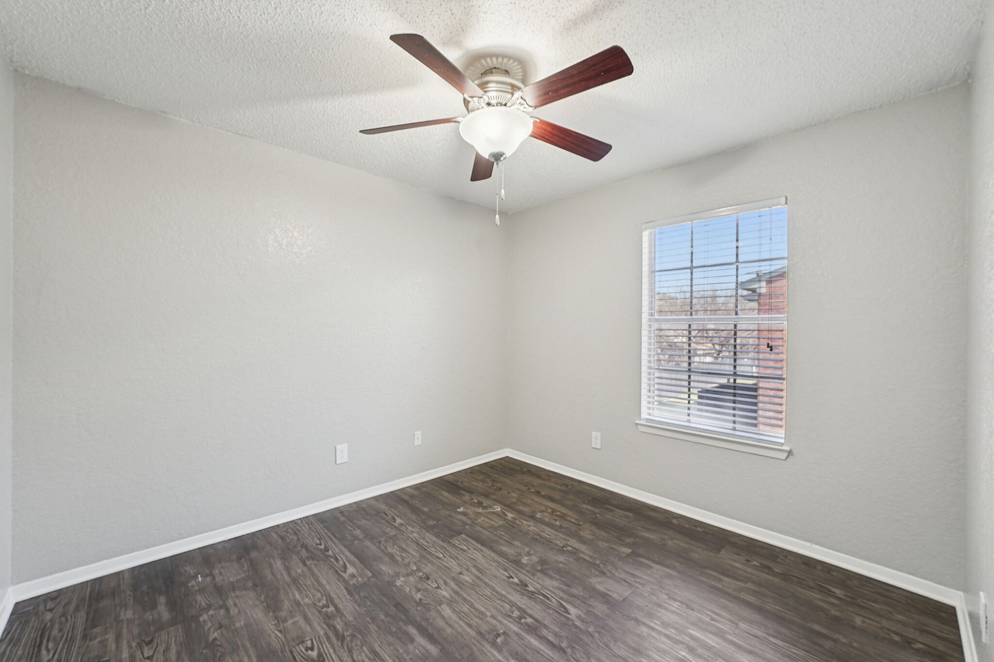 Spacious bedroom with ceiling fans