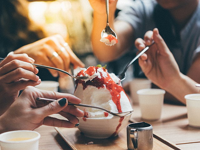 people eating a delicious dessert