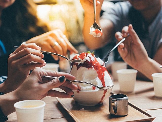 People sharing dessert at a nice restaurant