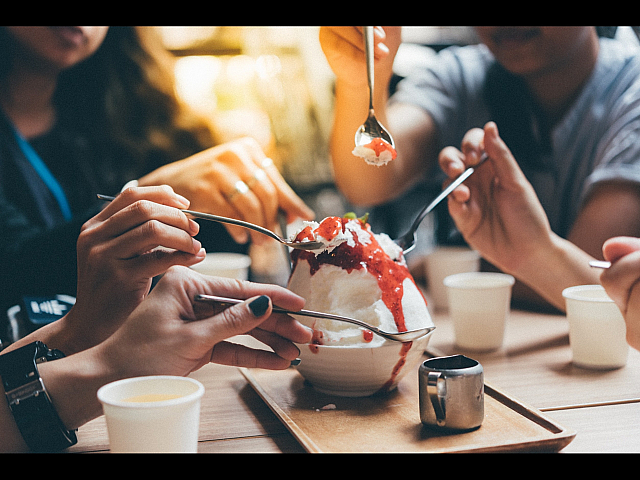 people sharing a delicious dessert