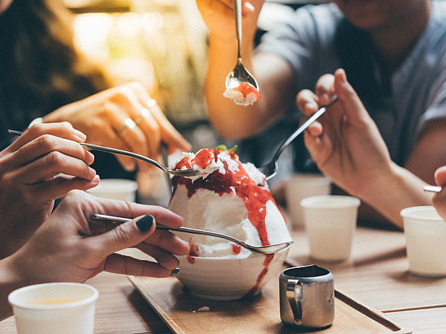 people sharing a delicious dessert