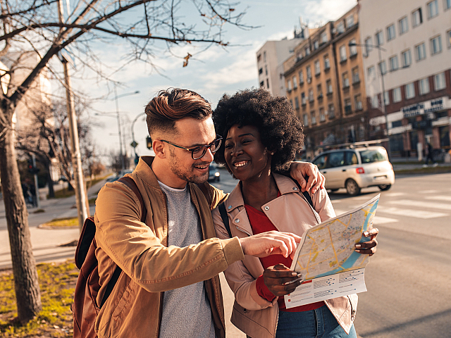 stock image of a couple exploring a town