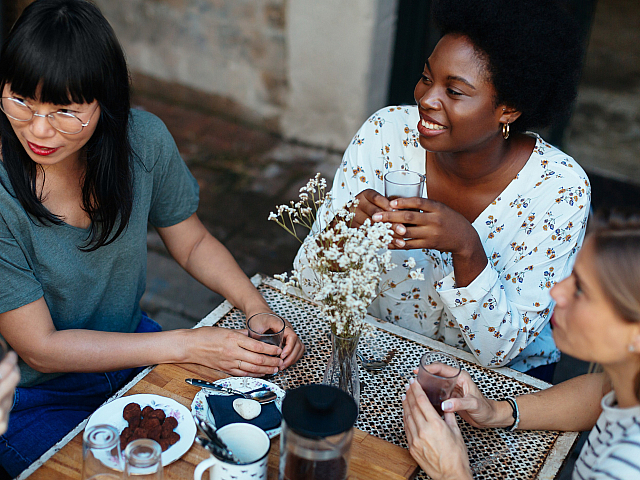 Three ladies out on the town at a cafe