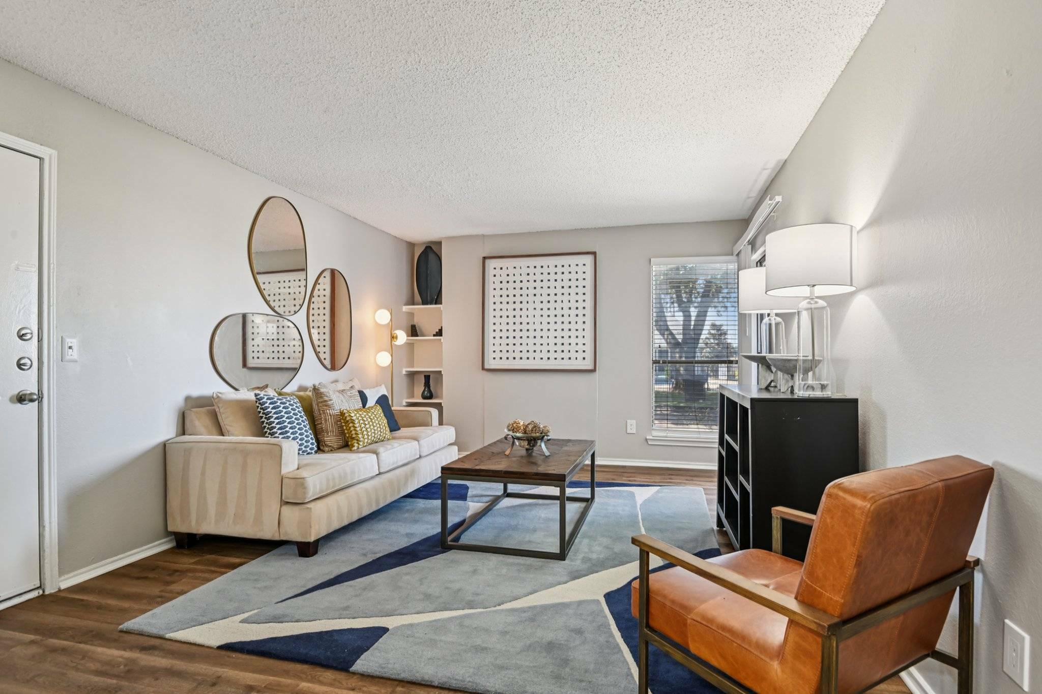 Hardwood floors and wood burning fireplace in unit