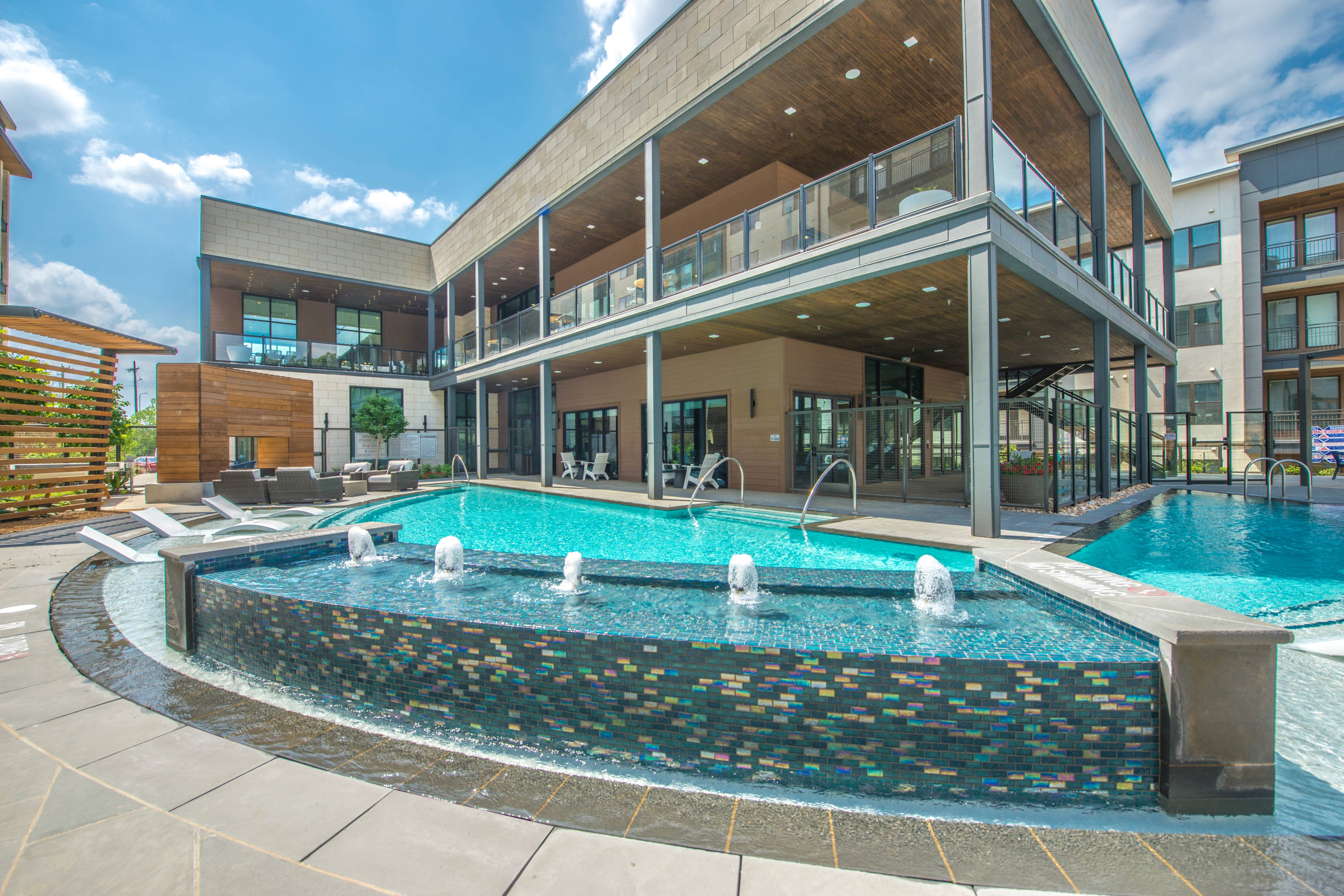 wrap around pool with lounge seating