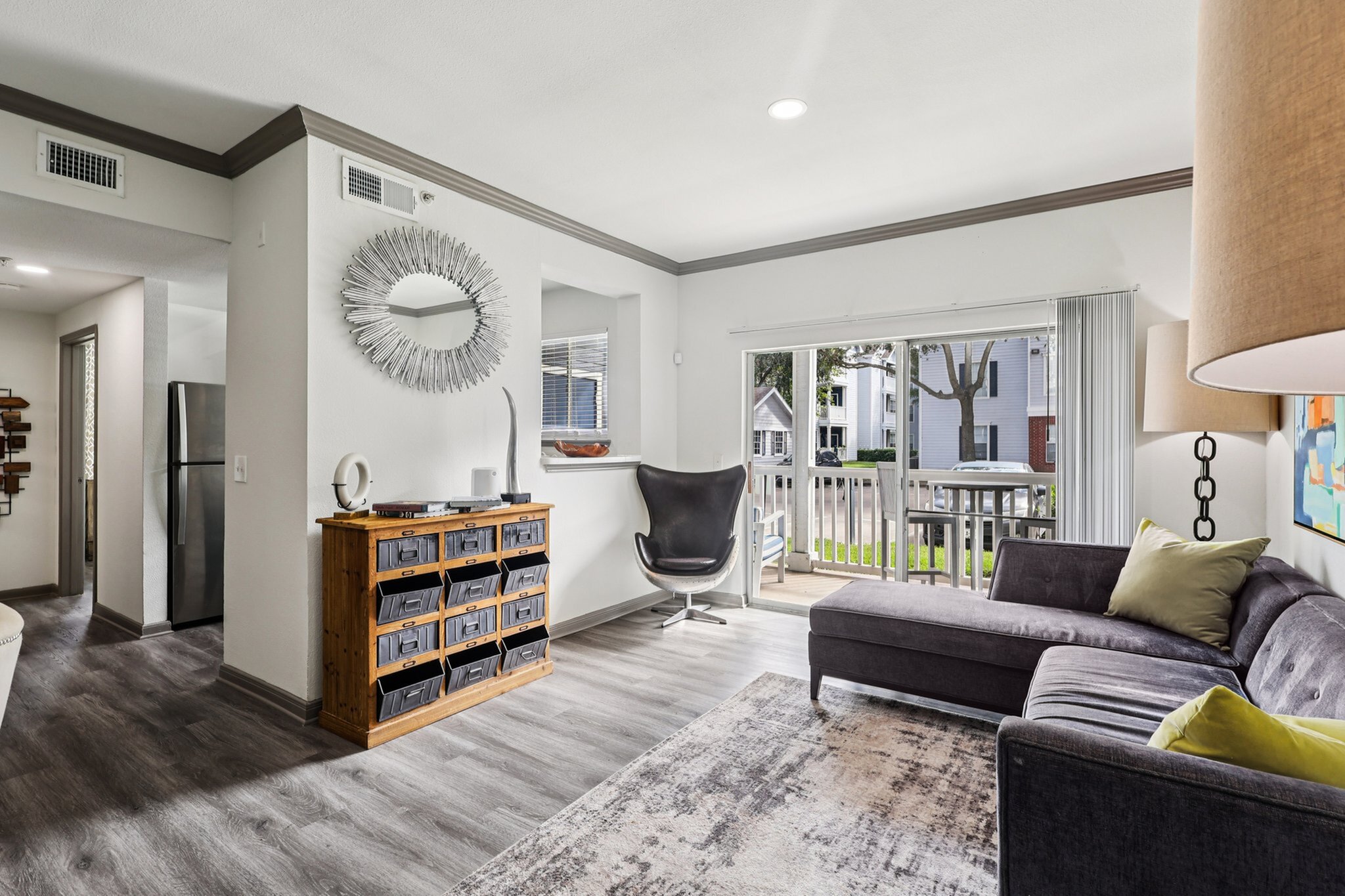 spacious living room with crown molding
