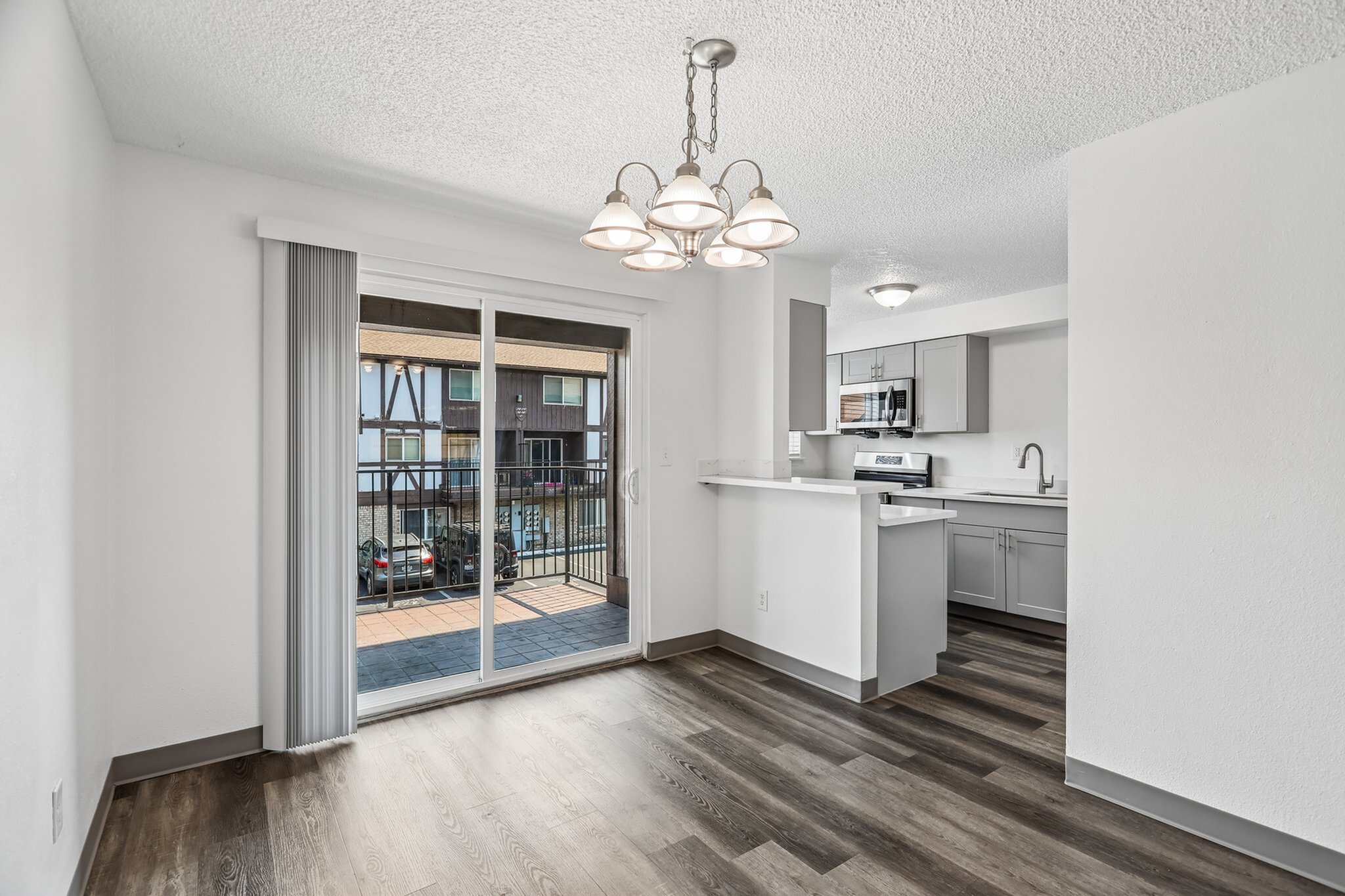 kitchen and living area open to balcony