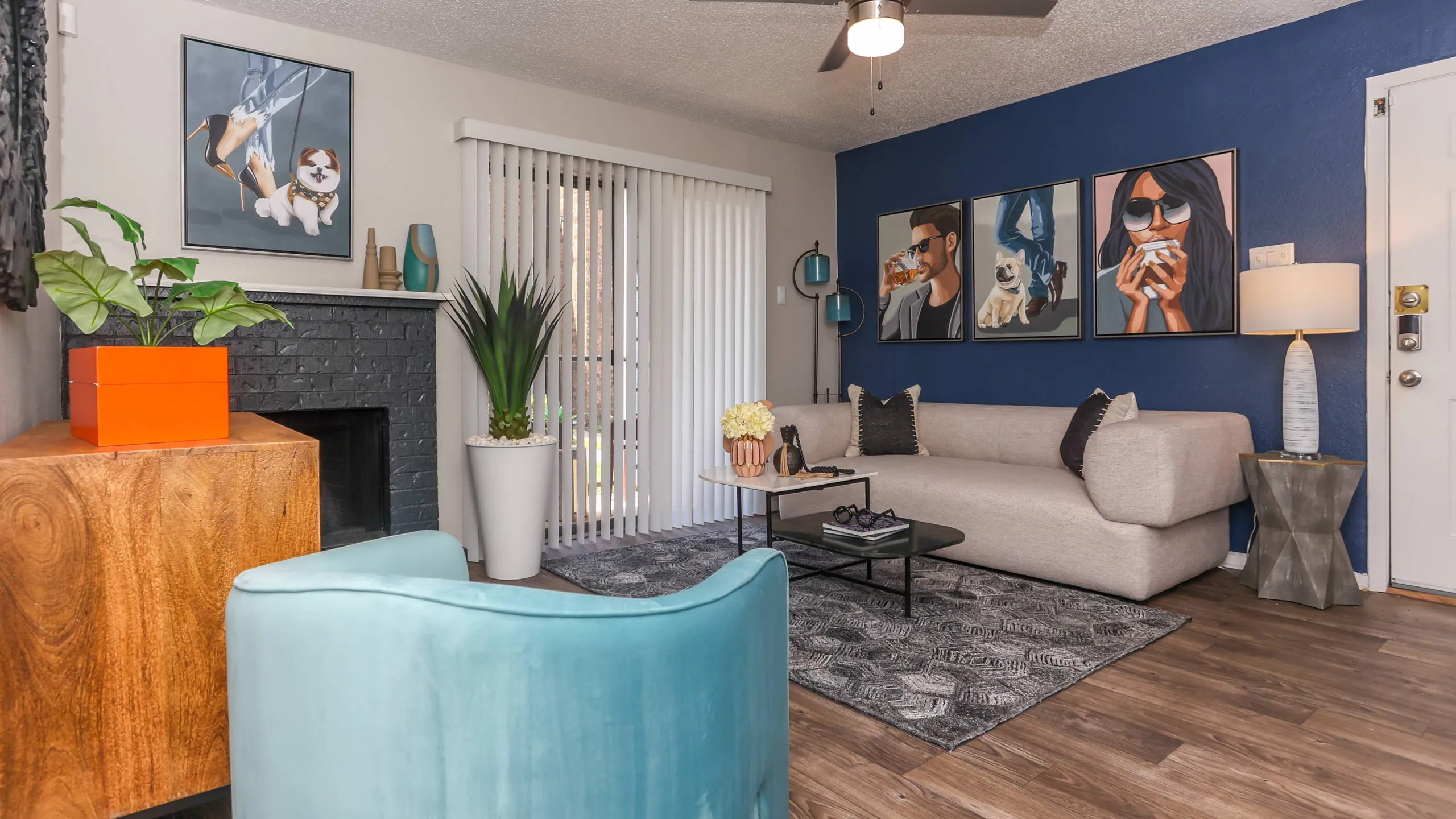 spacious living space with ceiling fan and fireplace