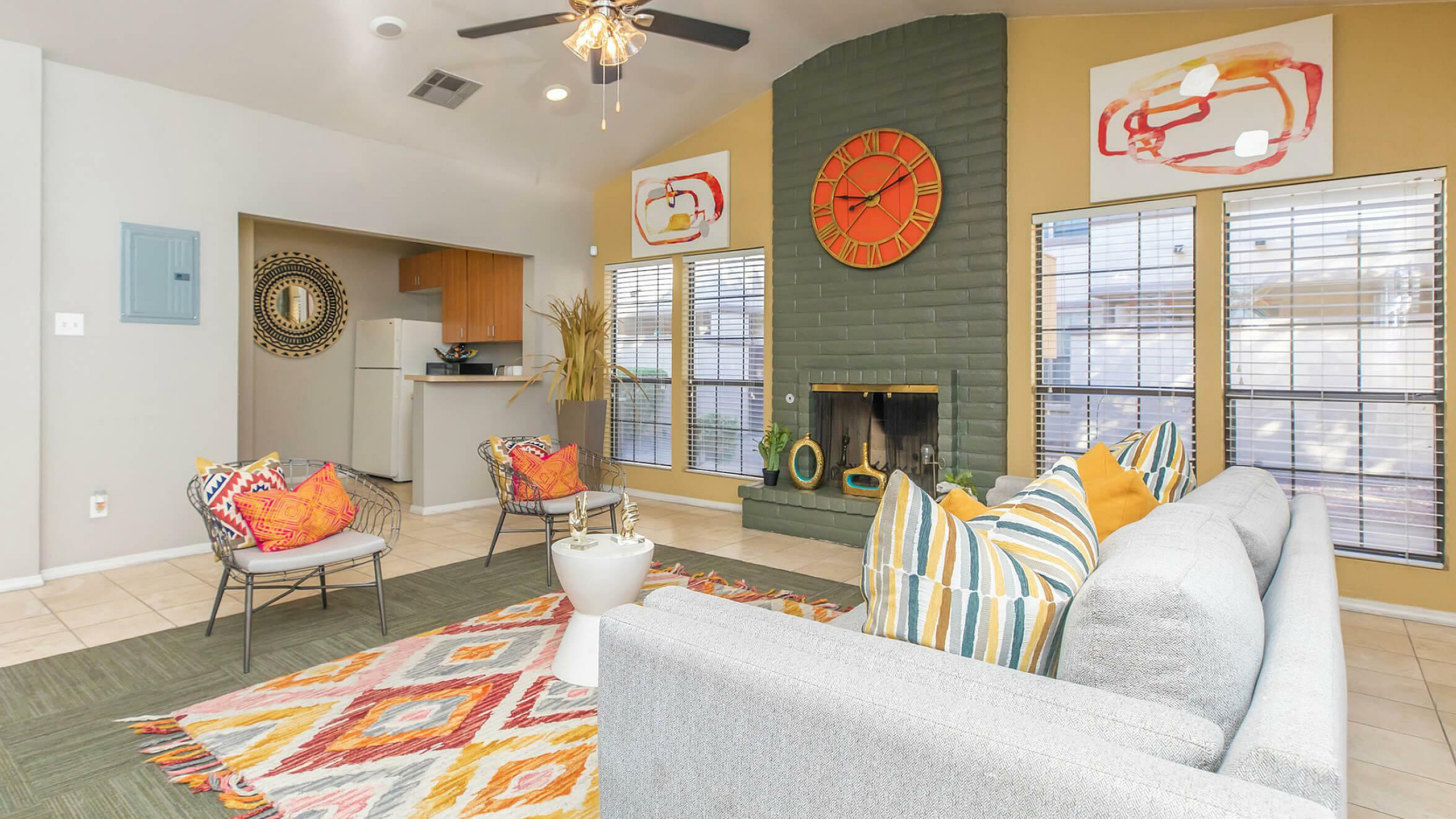 stylish clubhouse wiith fireplace and kitchenette
