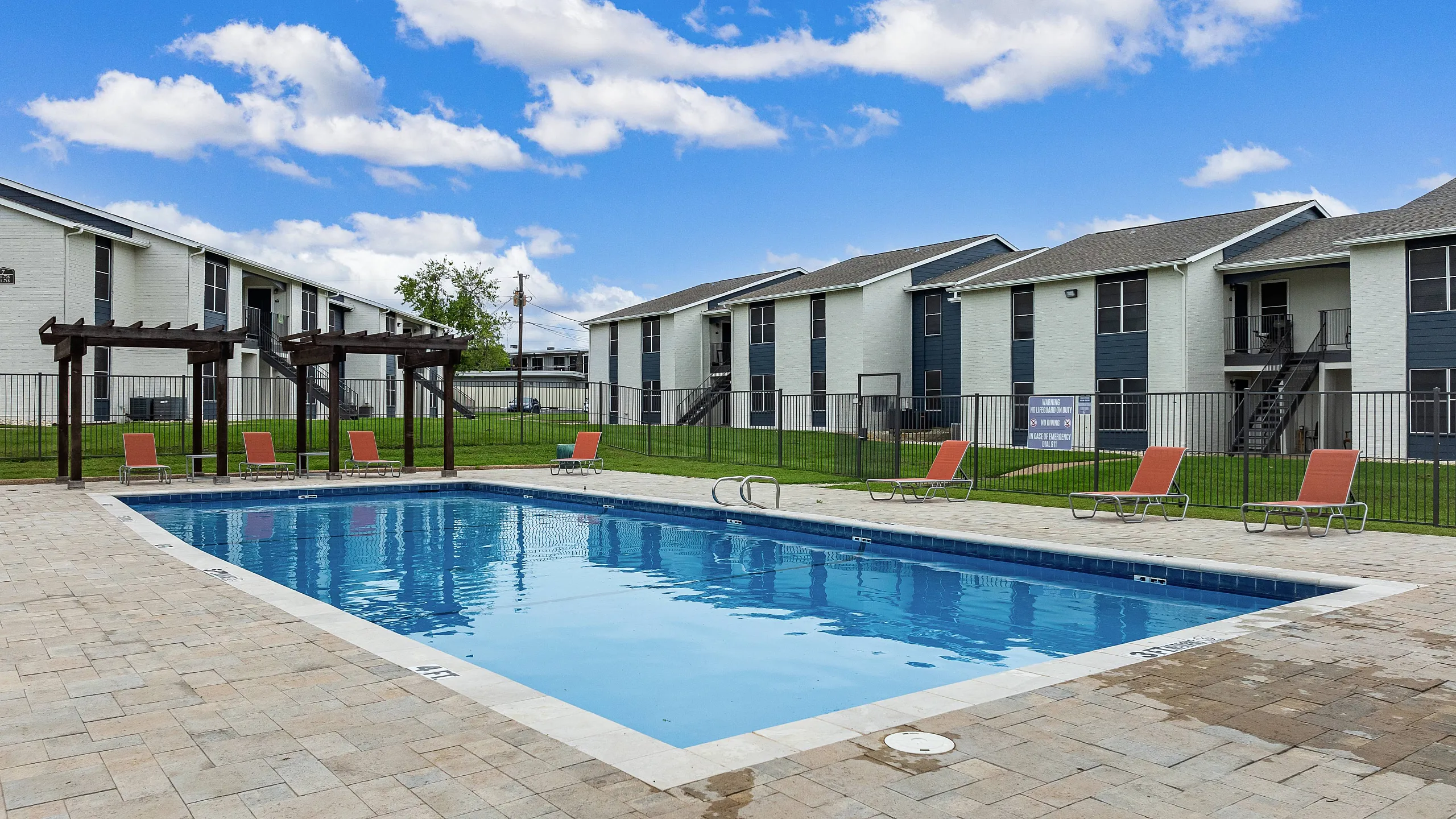 Sparkiling pool beside the apartment buildings