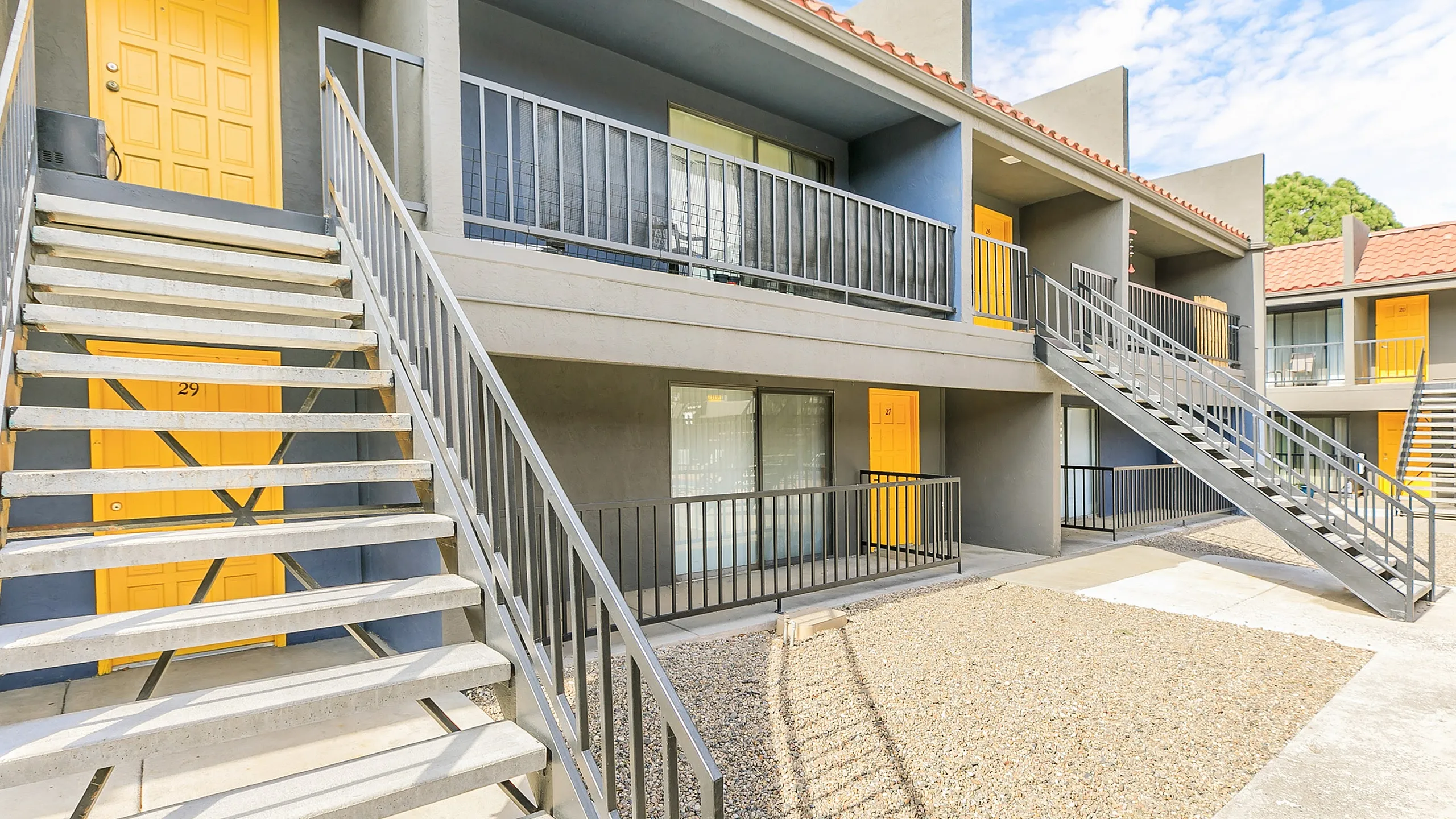 outside of apartment complex with yellow doors