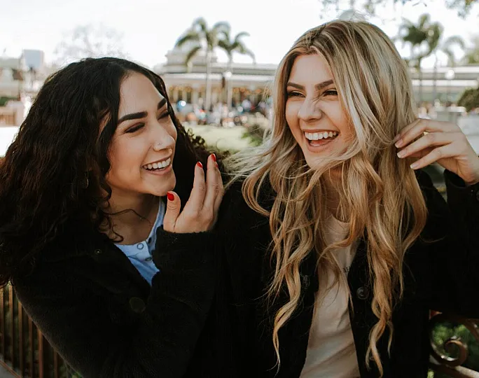 stock of two girls laughing