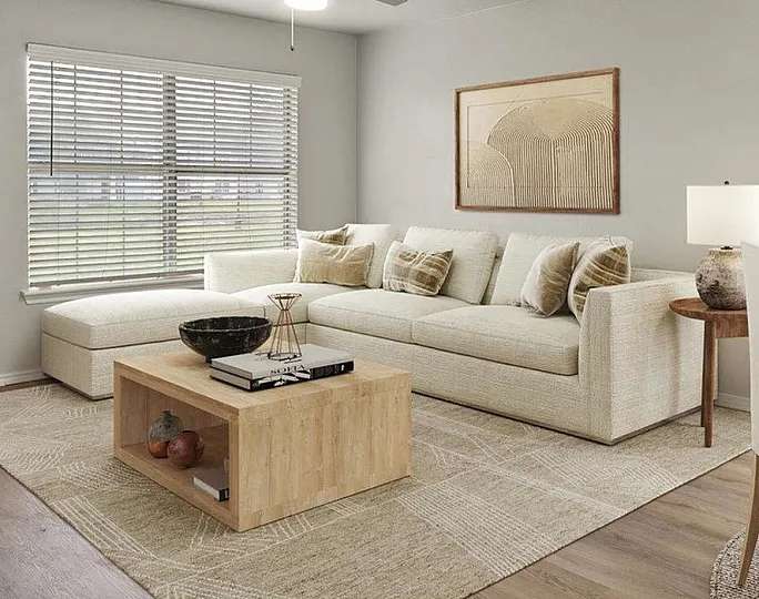 spacious living area in unit with wood inspired flooring and ceiling fan