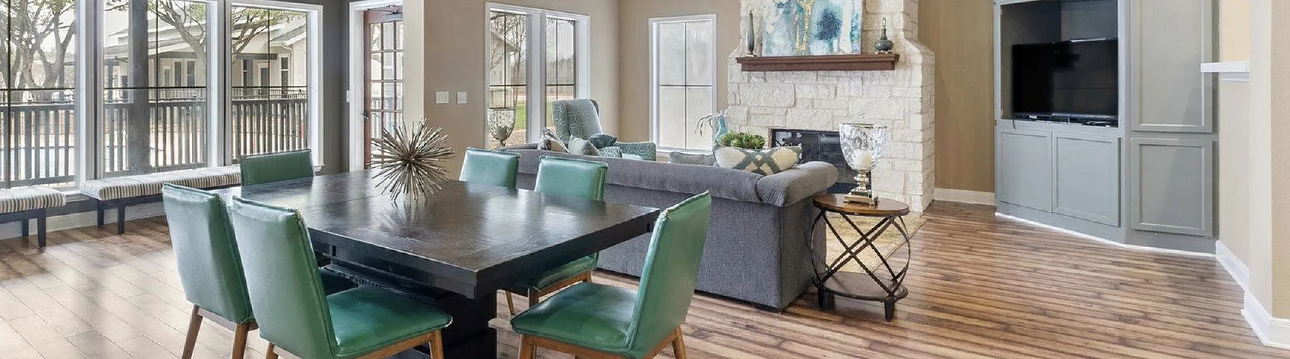 stylish clubhouse with fireplace and tv