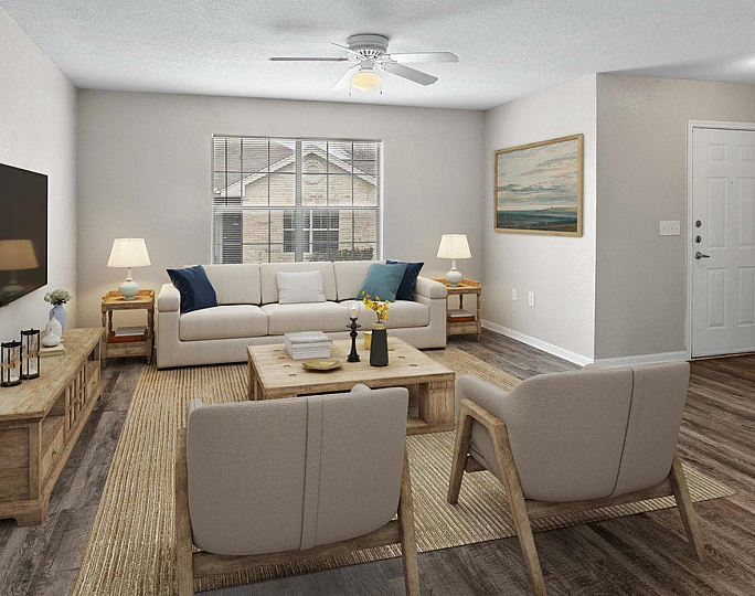 spacious living area with ceiling fan