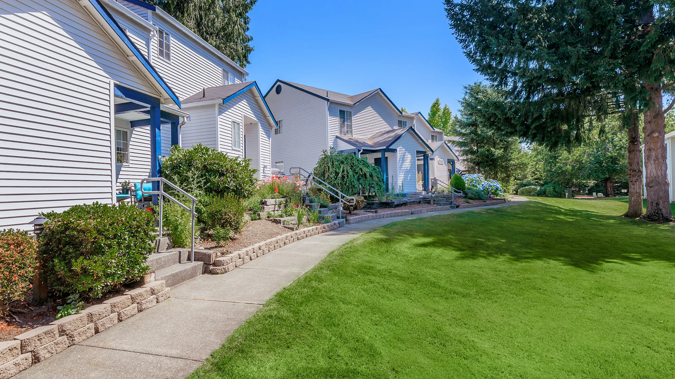 stylish landscaping and blue accented buildings