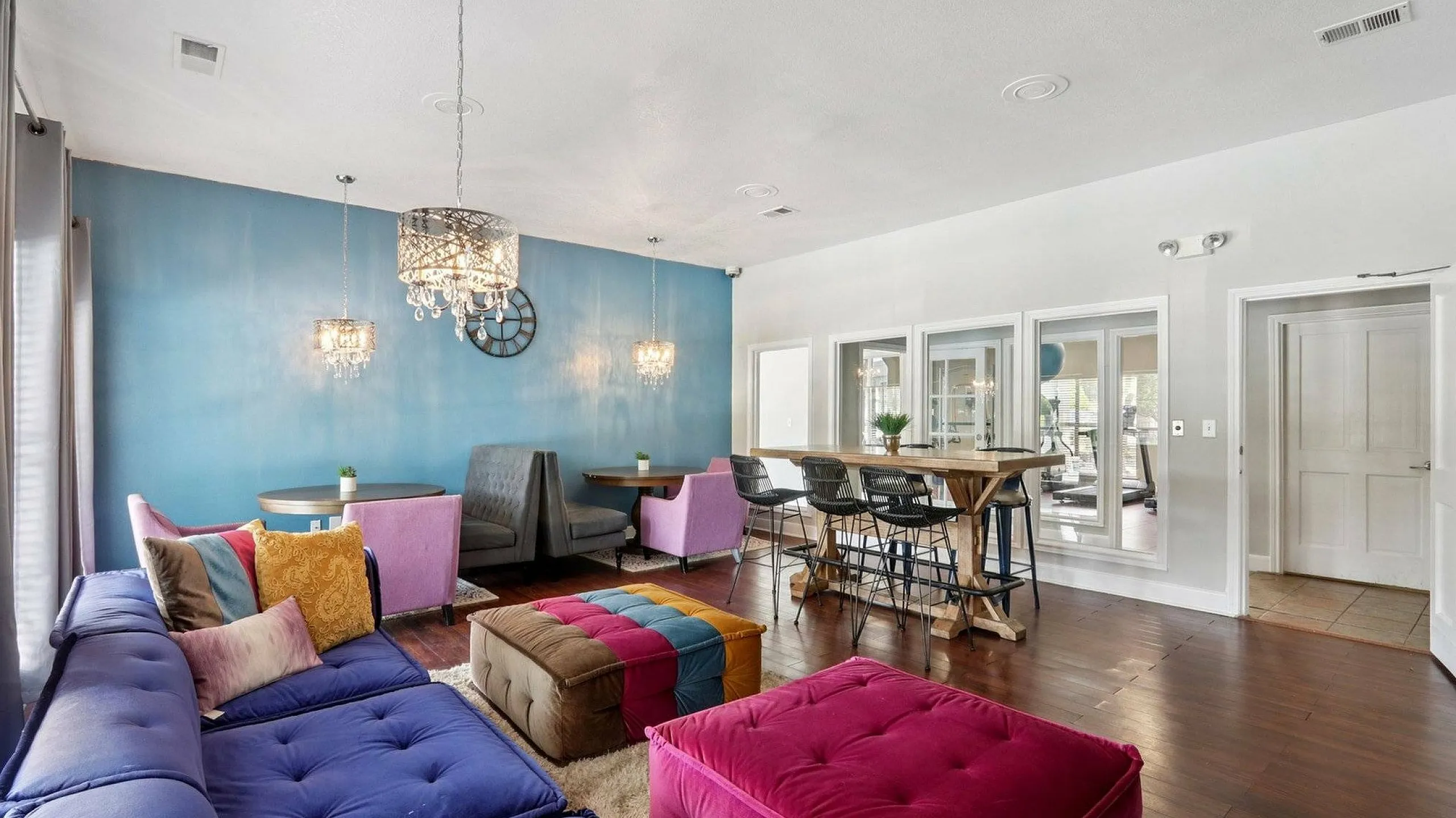 Resident Lounge with Blue Walls and Wooden Floors in Austin Texas