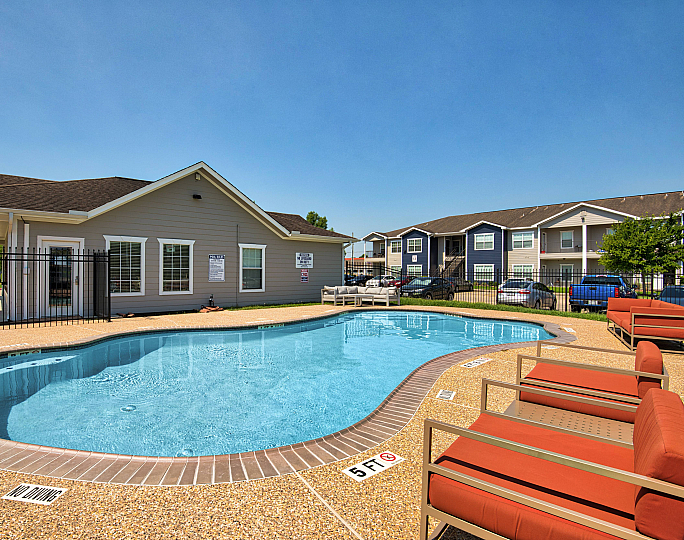 sparkiling pool with lounge seating