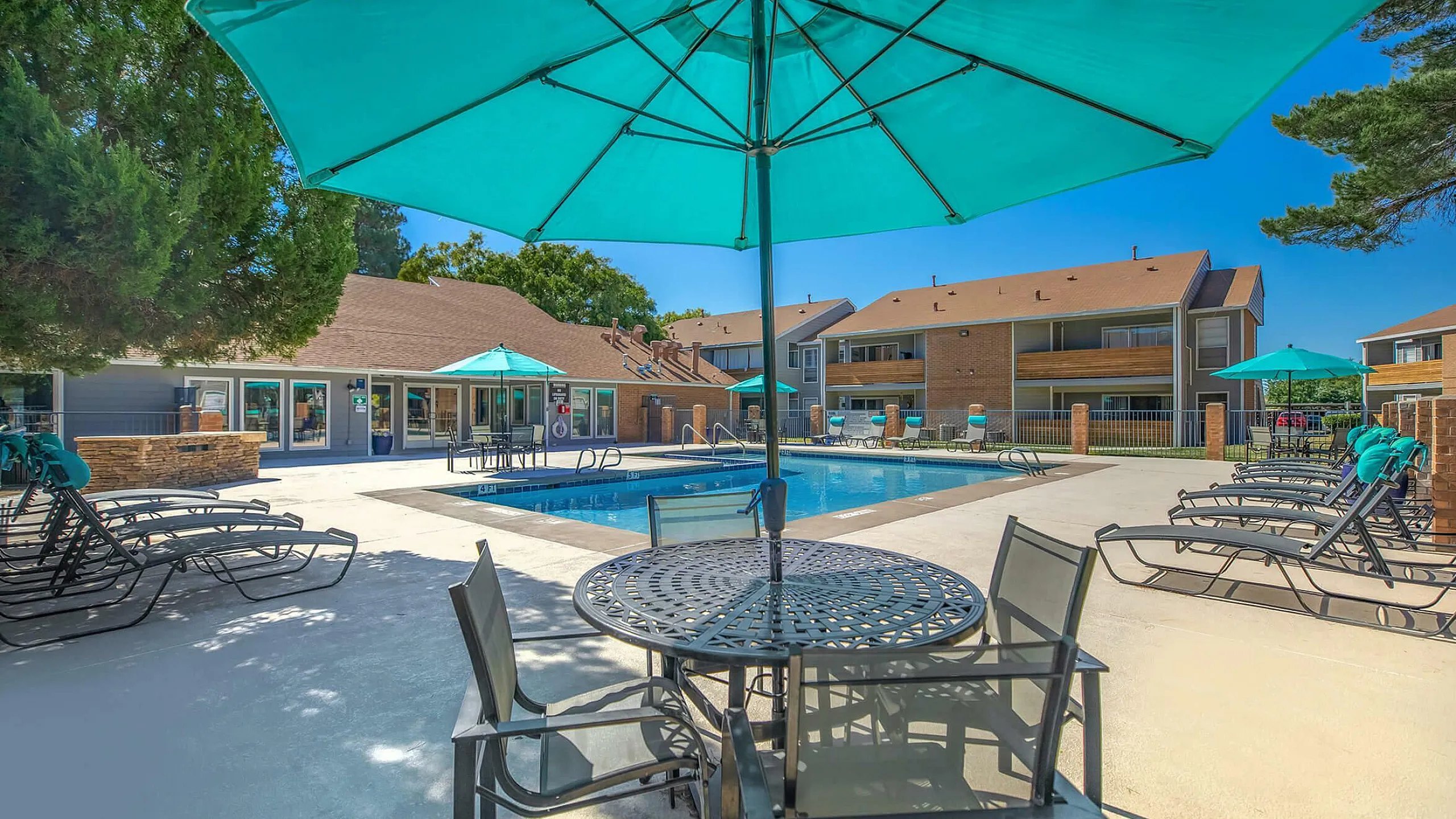 sparkiling pool and lounge seating