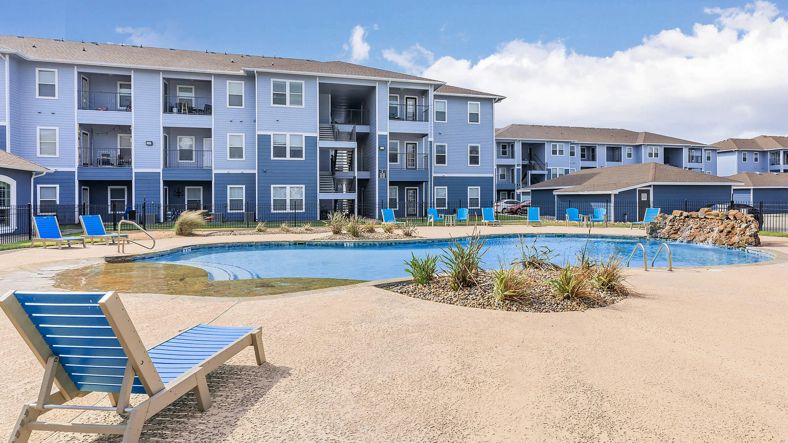 sparkiling pool with lounge seating