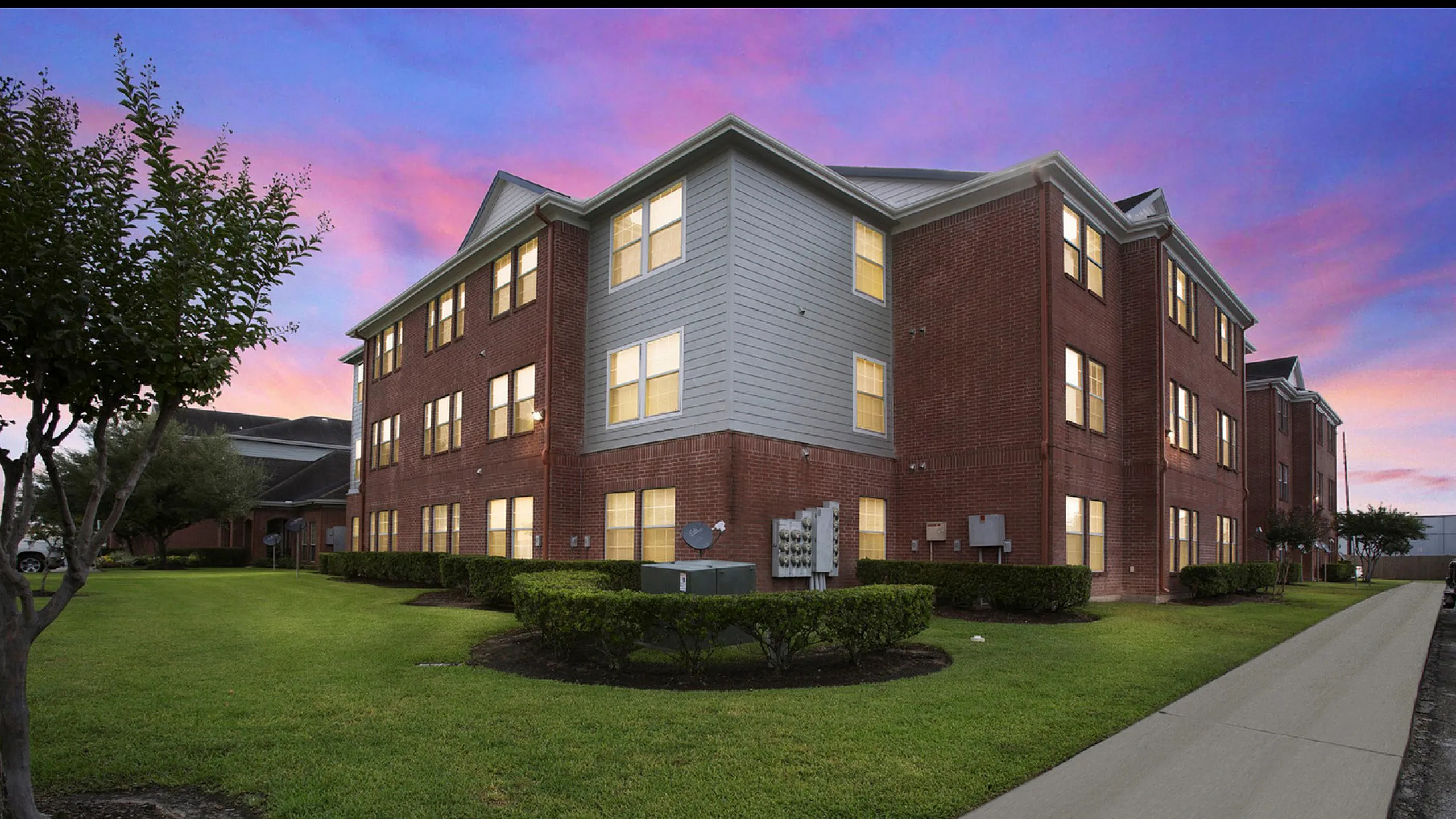 brick apartment building at twilight