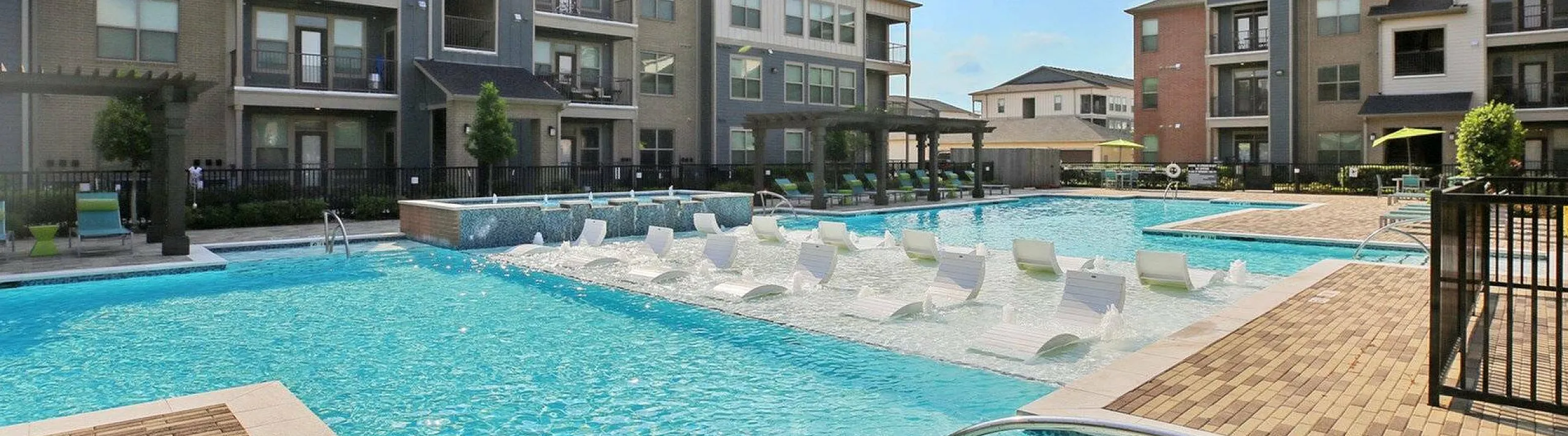 sparkling pool with lounge seating