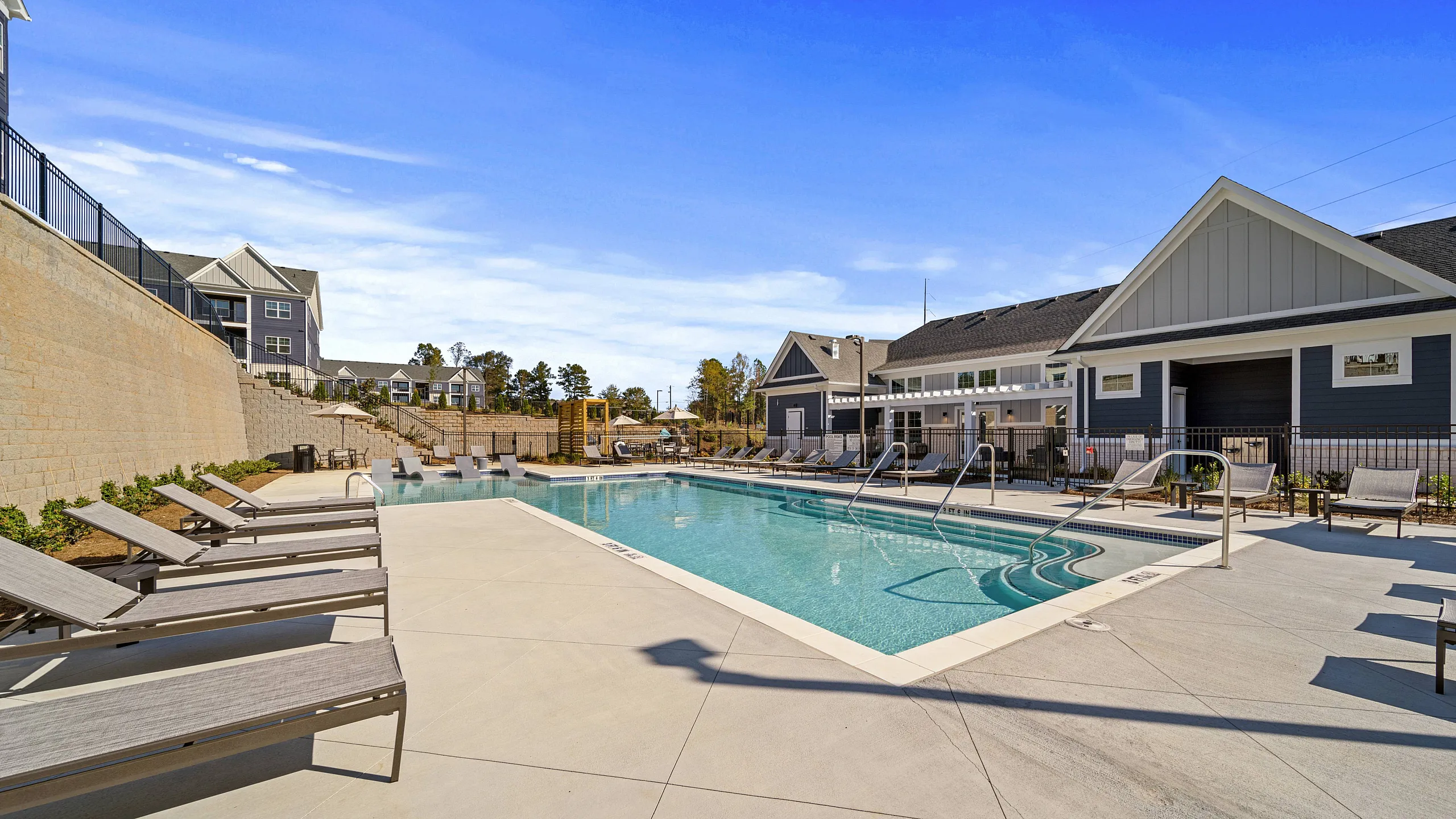 Resort style pool with lounge seating