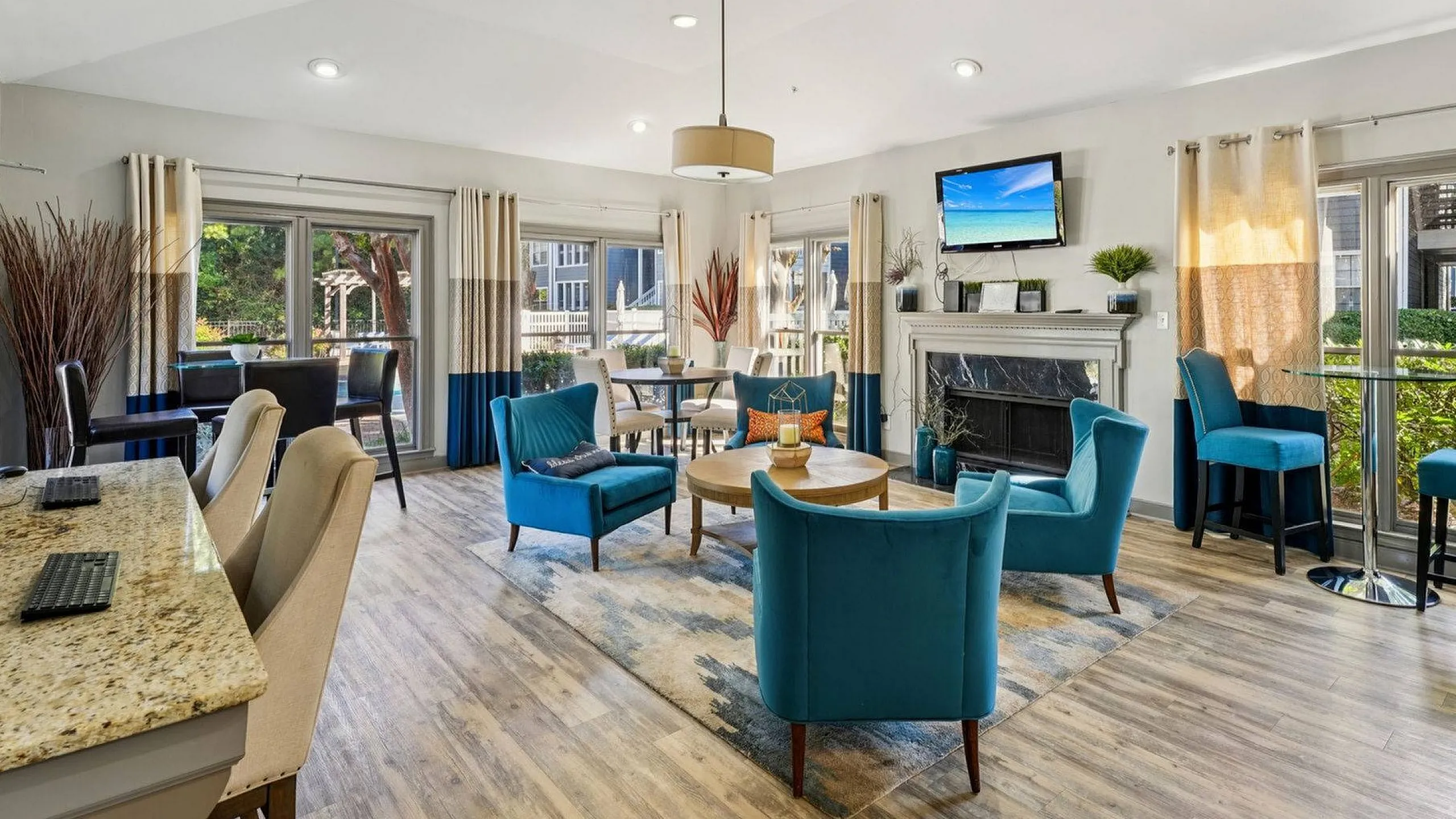 stylish resident lounge with fireplace and tv