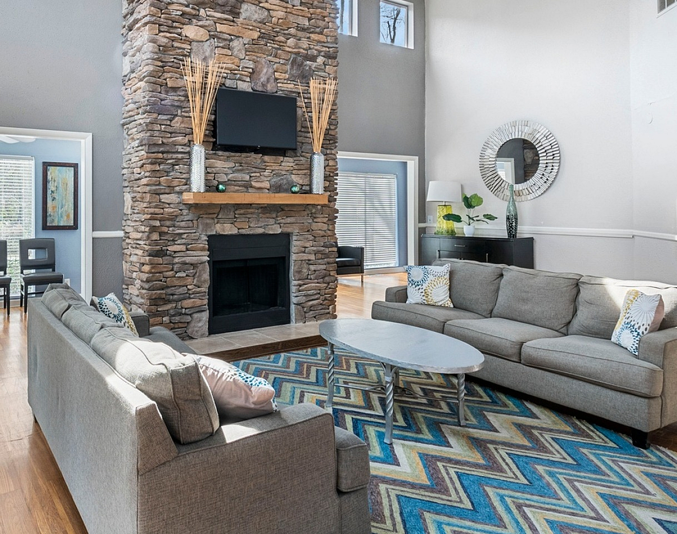stylish clubhouse with fireplace and entertainment system