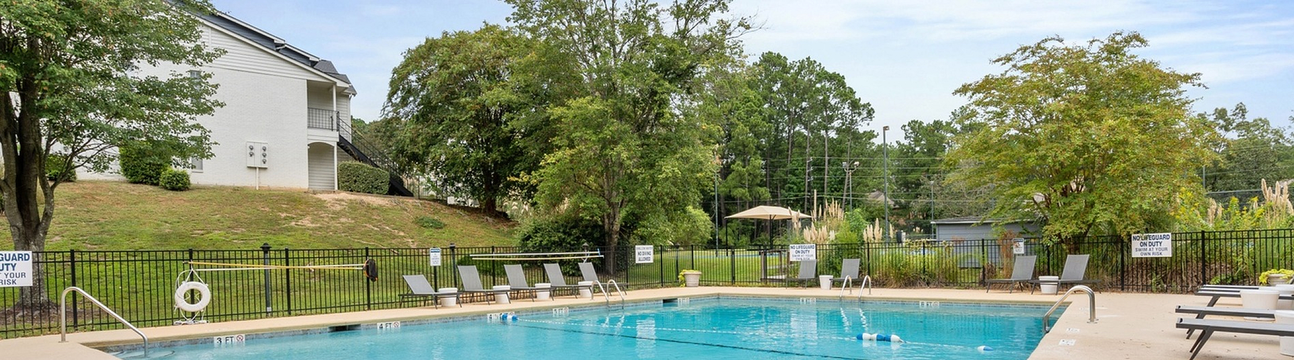 beautiful landscaping beside the pool