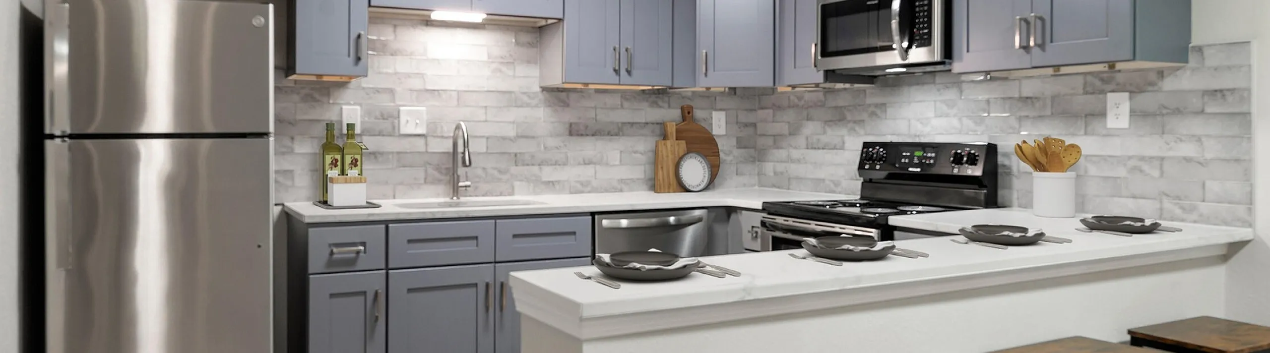 state of the art kitchen with stainless steel appliances