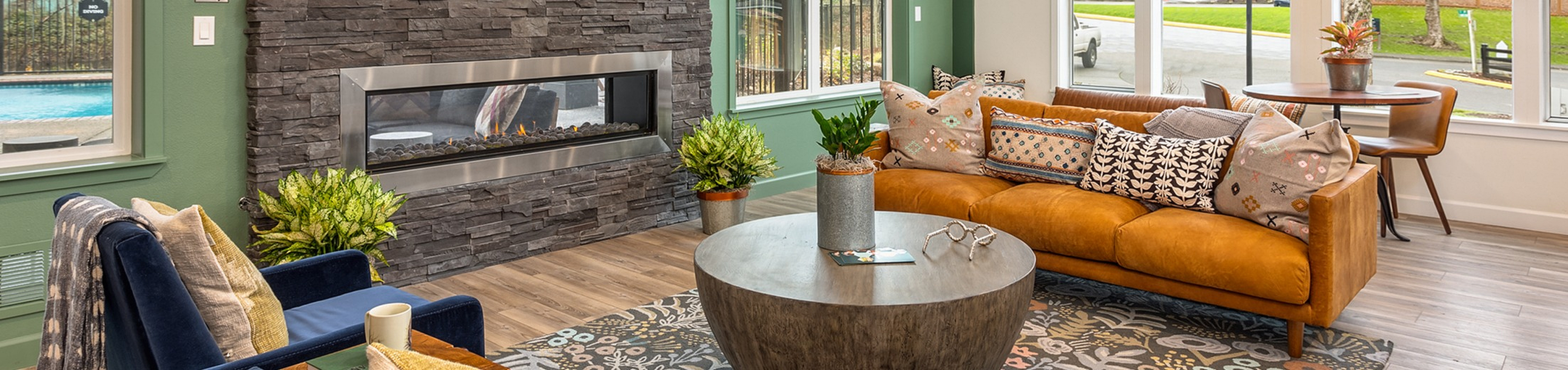 clubhouse with fireplace and tons of natural light