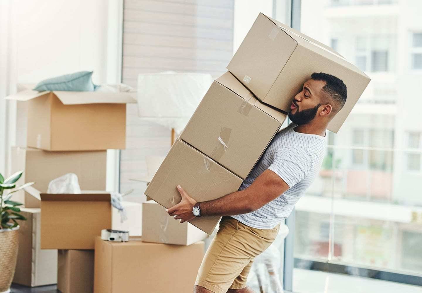 man moving boxes