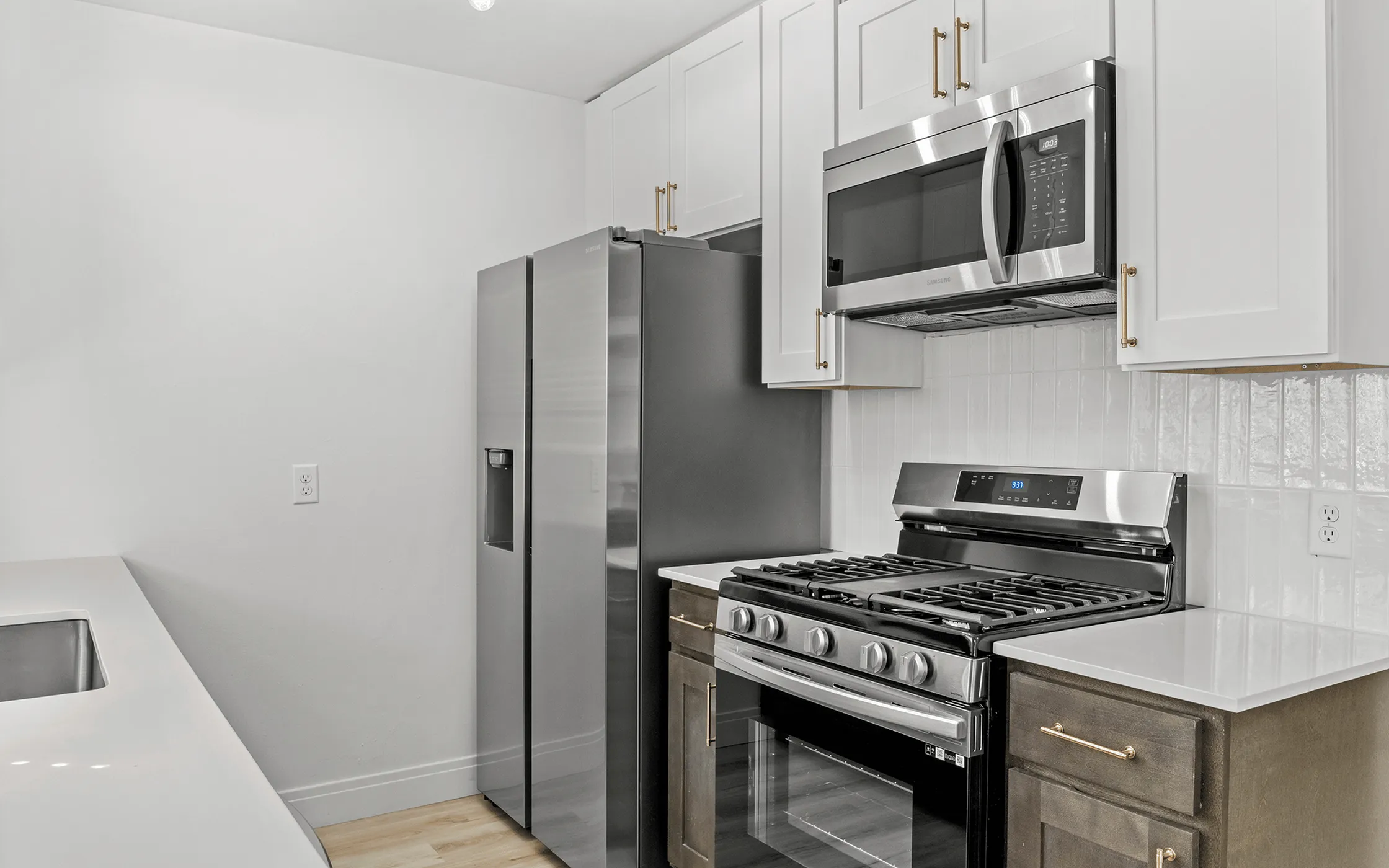Contemporary kitchen design featuring sleek stainless steel appliances, modern cabinetry, and elegant countertops.