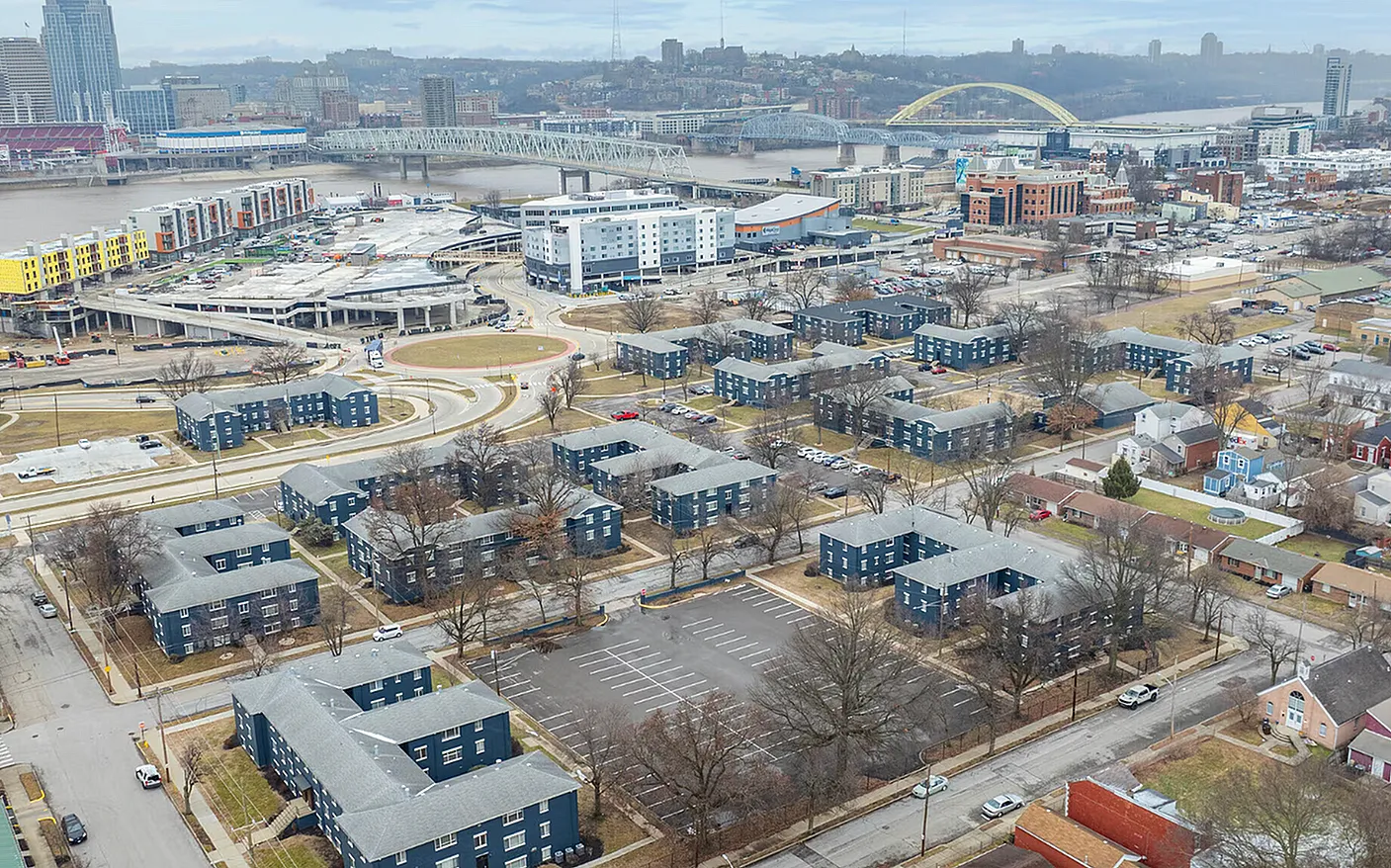 Charming urban neighborhood with modern apartments, stunning river views, and vibrant cityscape.