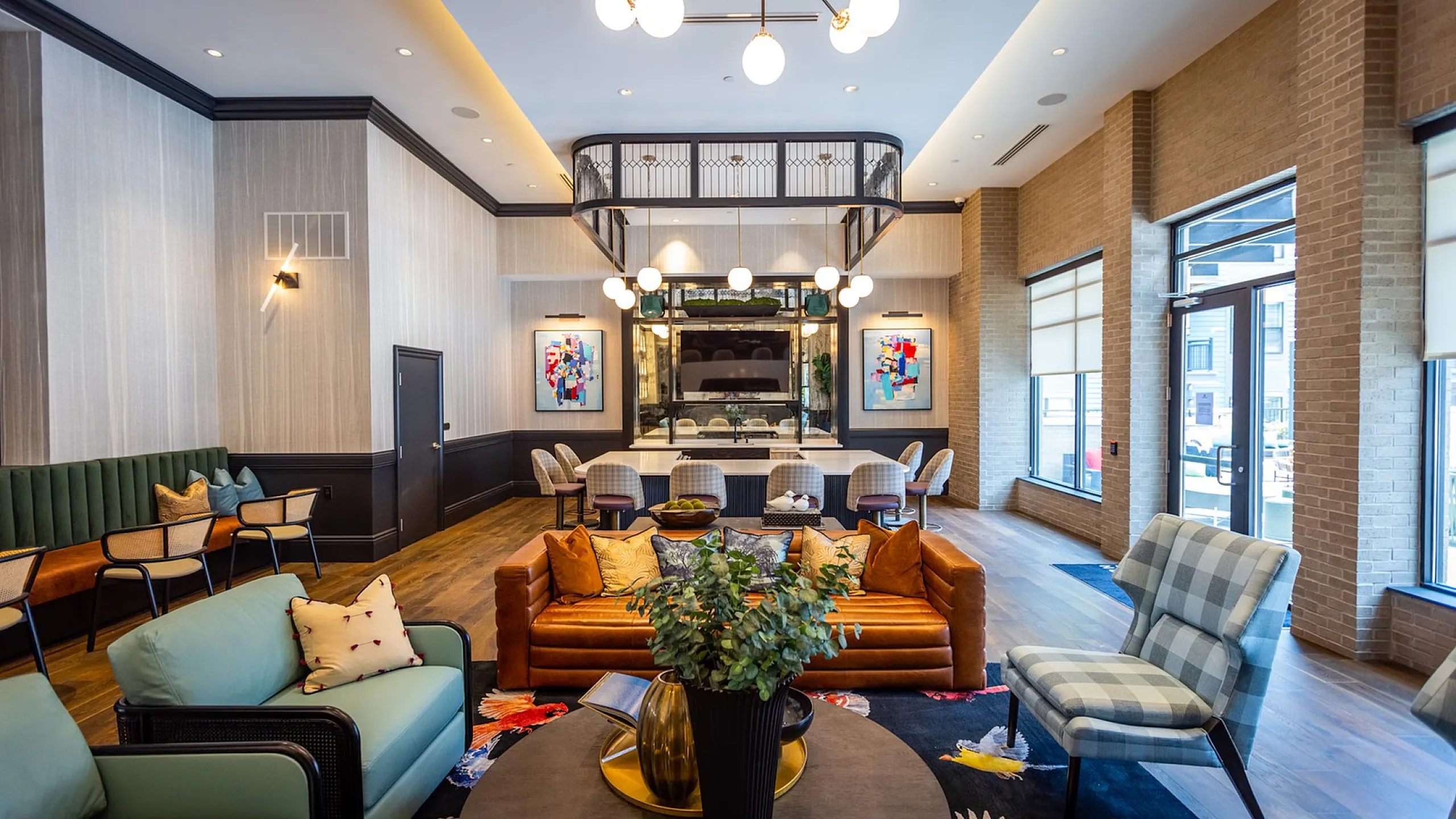 Inviting and stylish lounge area with chic furniture, vibrant artwork, and a modern open space perfect for relaxation and social gatherings.