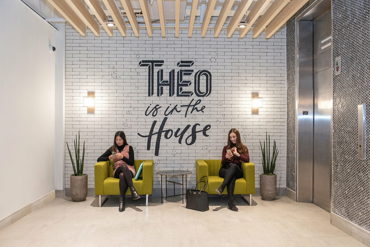 students in lobby on chairs