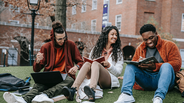 students reading outside