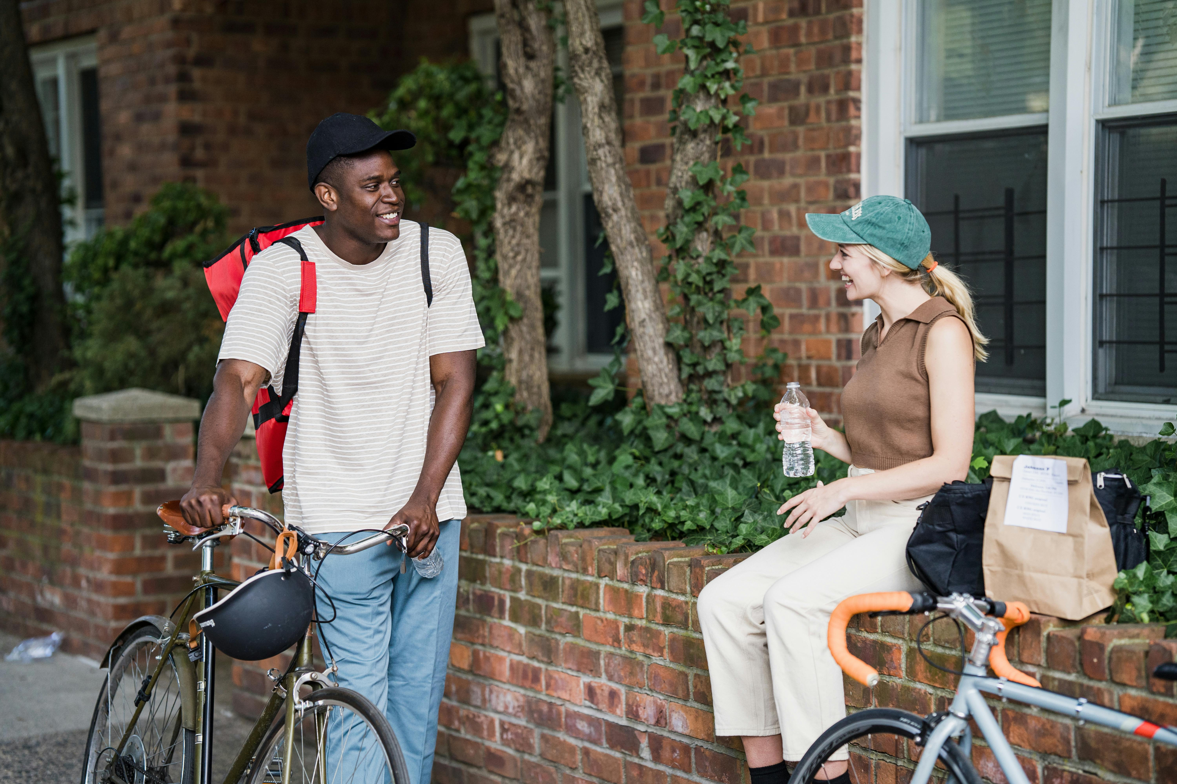 students laughing outside with bikes