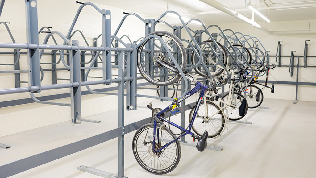 Modern bike storage facility featuring secure racks and ample lighting, perfect for urban cycling enthusiasts.