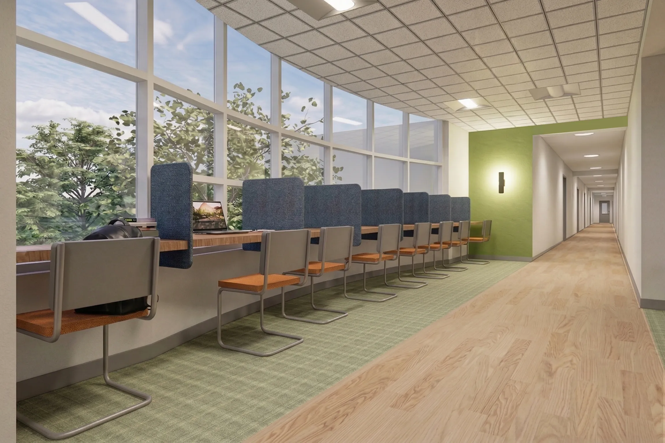 Inviting study area with individual workstations along large windows, offering a serene view of greenery for an inspiring workspace.