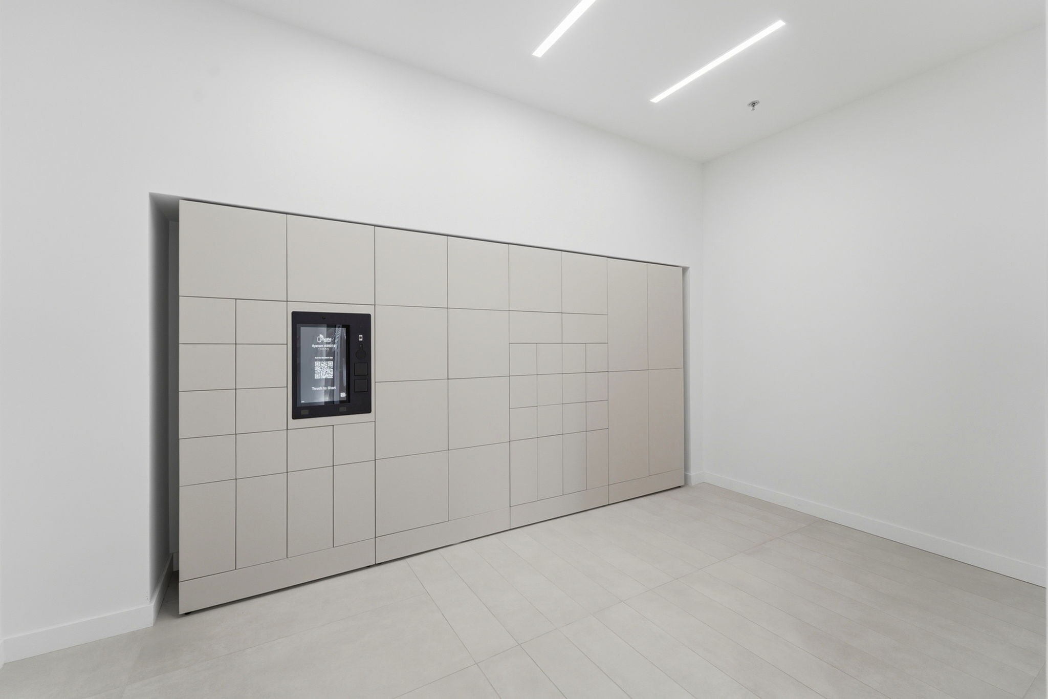 Modern and sleek lobby area featuring an elegant package locker system with digital interface, maximizing convenience and style.
