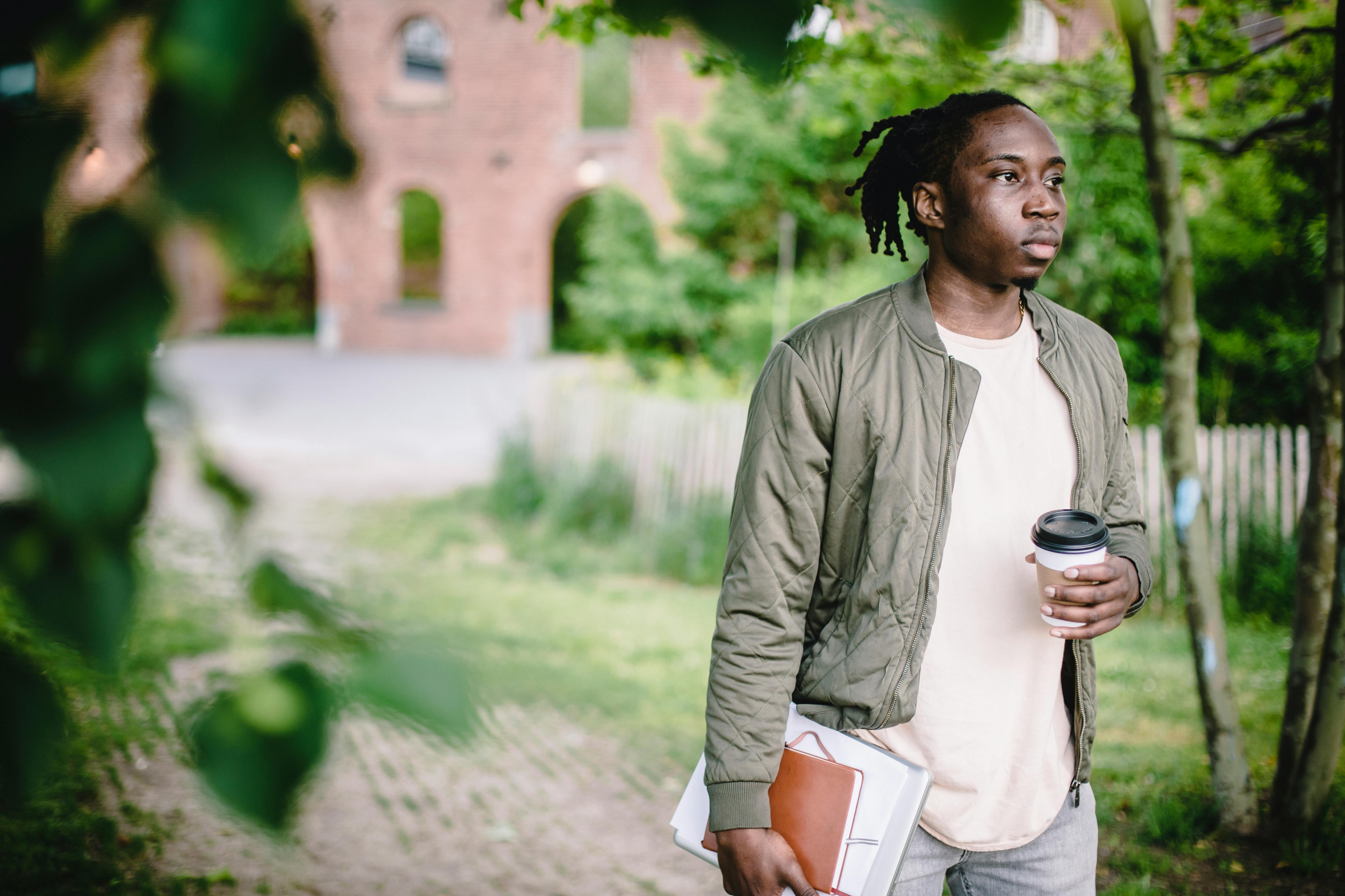 student walking outside in park