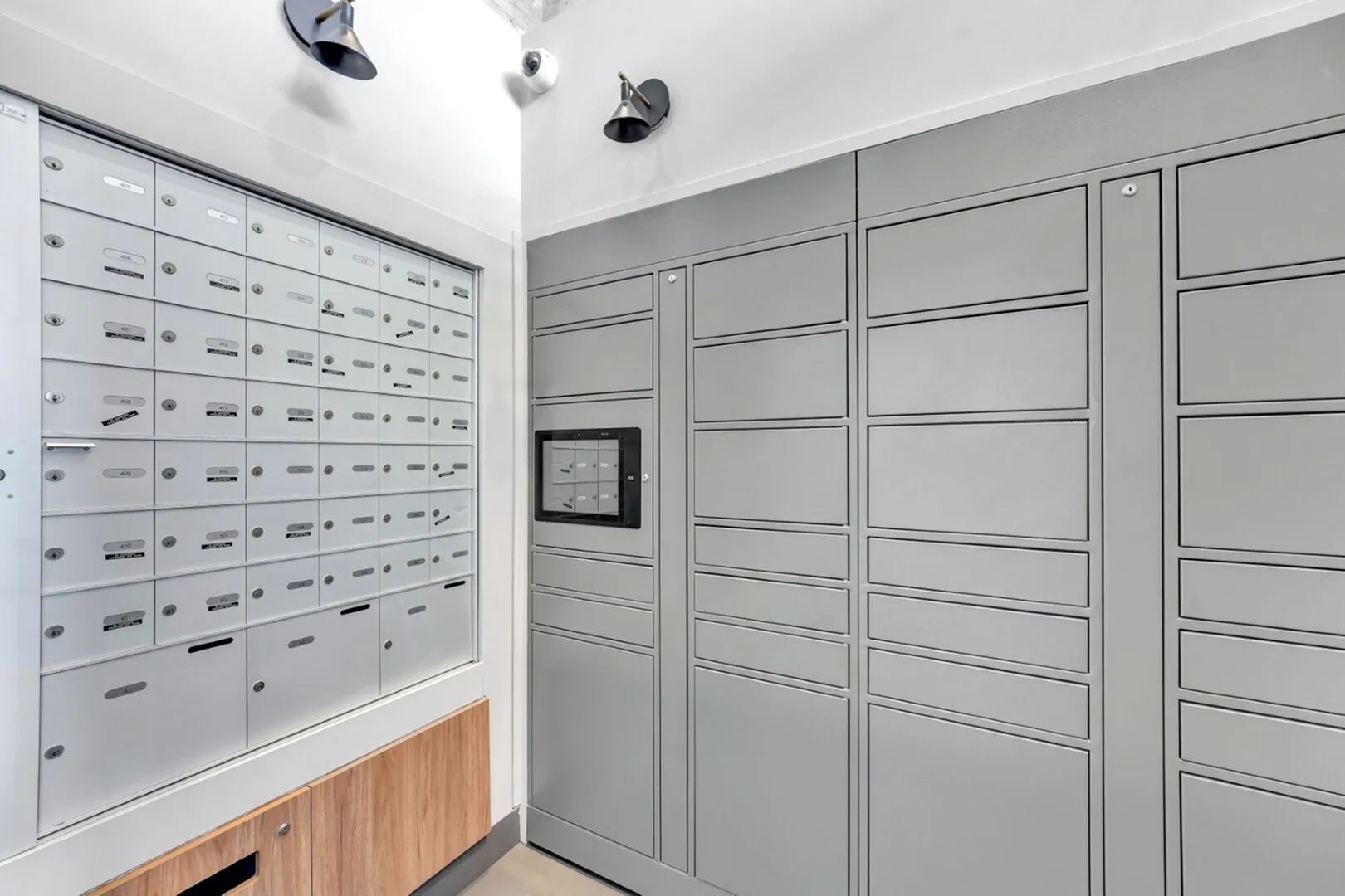 Modern mailroom with sleek lockers and secure postal boxes, offering convenience and style.