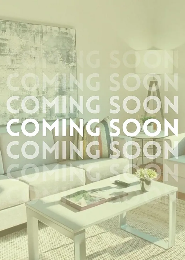 Bright and modern living room featuring cozy sofas, elegant decor, and ample natural light.