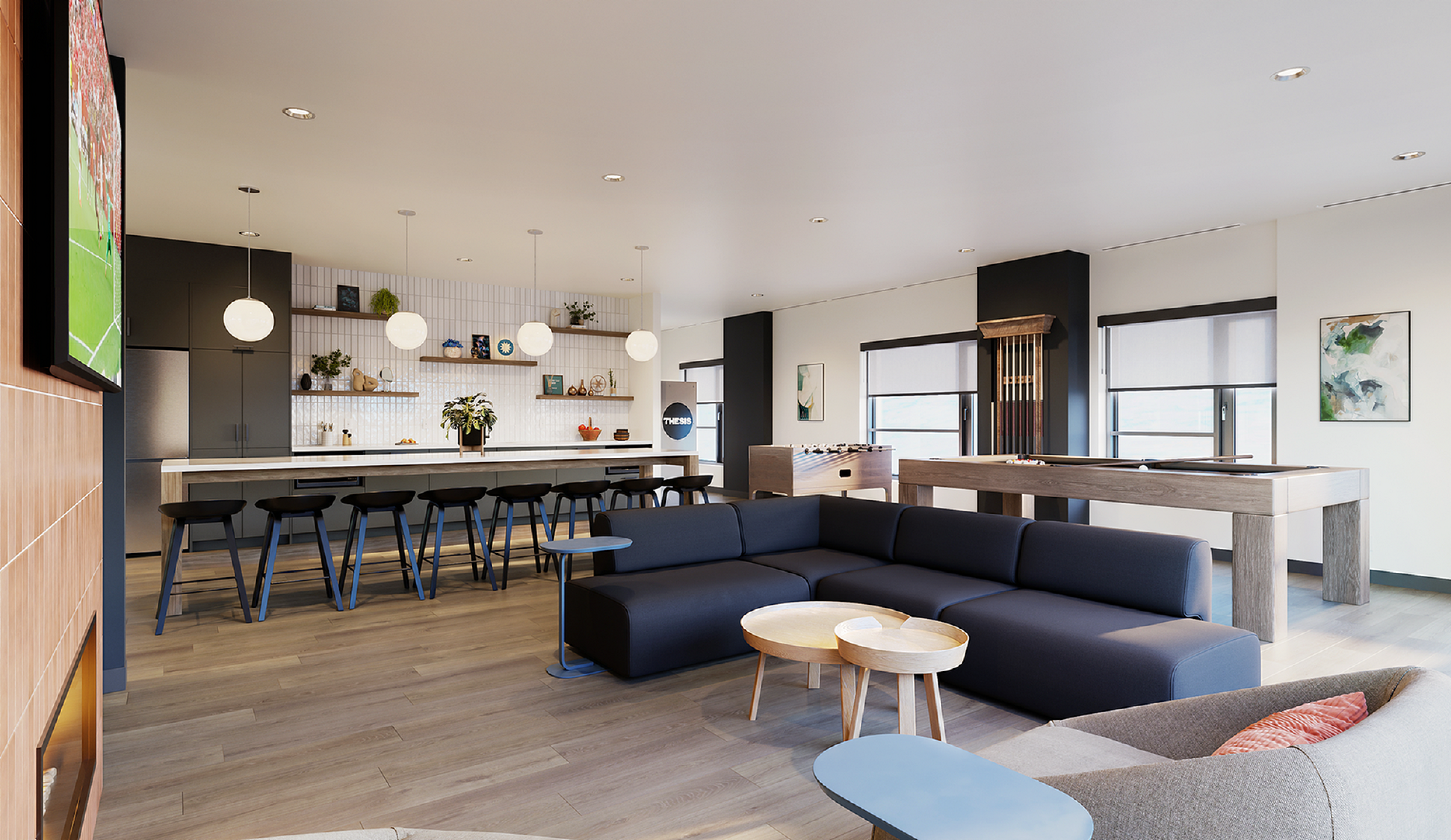 Modern open-plan living space with sleek kitchen, stylish bar seating, cozy lounge area, and a pool table, perfect for entertaining.