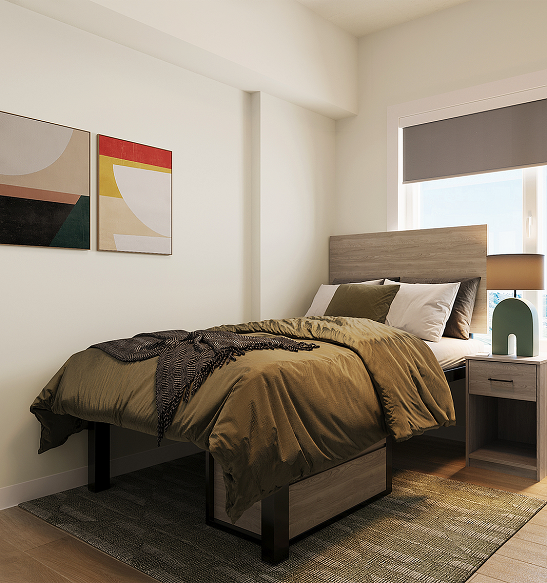 Cozy bedroom with modern furnishings, featuring a comfortable bed with stylish bedding, a wooden nightstand with a chic lamp, and a functional desk with a computer setup near a bright window.
